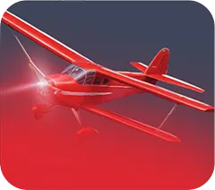 Red single-engine propeller airplane flying against a dark sky with red gradient below.