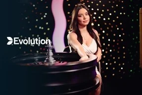 Woman in white dress standing beside a roulette wheel in a casino setting with Evolution logo.